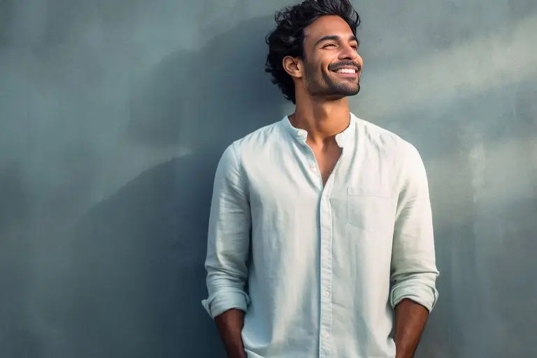 Man with full hair on concrete background