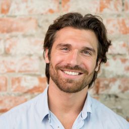 happy man with successful results of advanced hair restoration in Cleveland