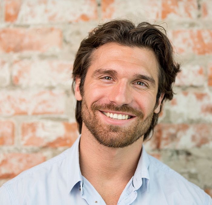 happy man with successful results of advanced hair restoration in Cleveland