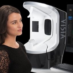 woman reviewing her skin analysis from the visia skin technology during a consultation