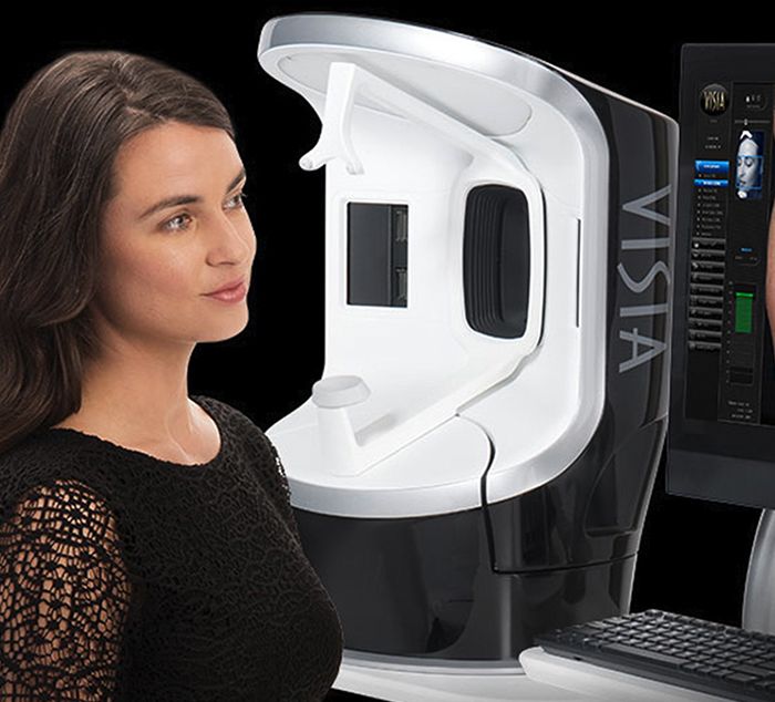 woman reviewing her skin analysis from the visia skin technology during a consultation
