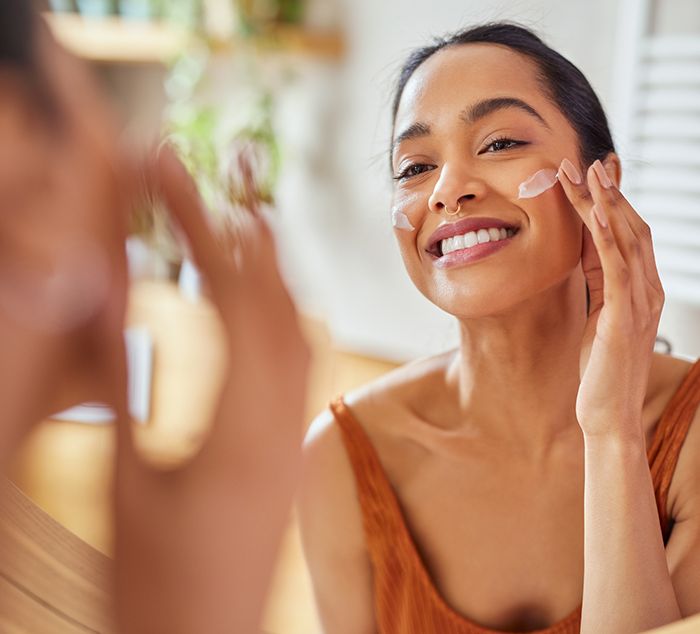 beautiful women with lovely skin applying medical grade skincare products recommended by NuIQ