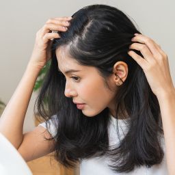 woman with thinning hair considering hair transplants and alternatives in Cleveland