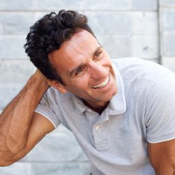 man with full hair after hair restoration therapy in Cleveland