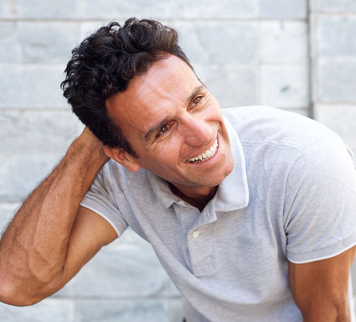 man with full hair after hair restoration therapy in Cleveland