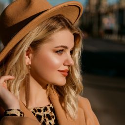 woman with beautiful glowing skin wearing stylish outfit
