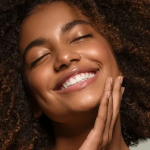 woman with radiant skin after a Glytone Salicylic Clarifying Chemical Peel