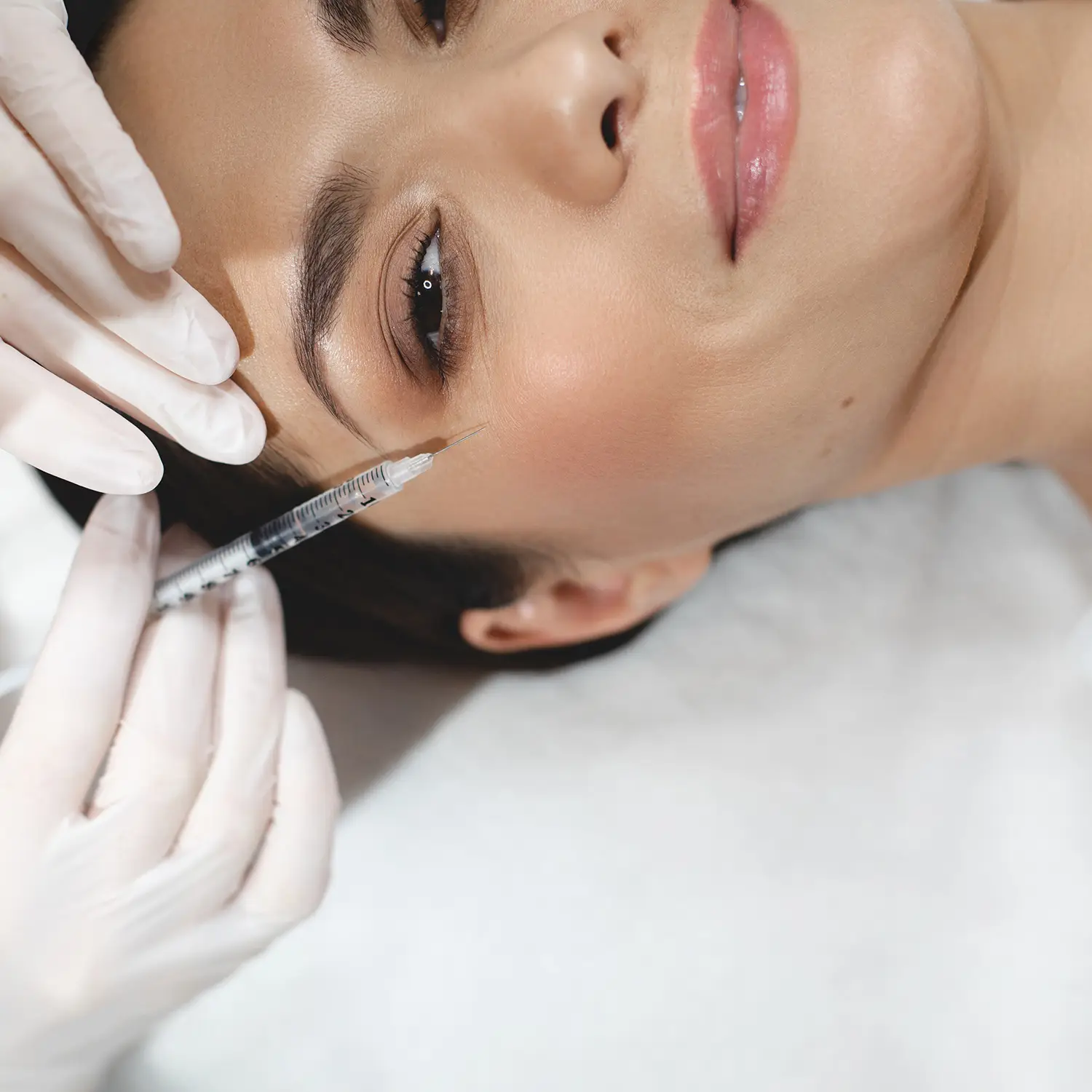 woman getting botox treatment at NuIQ Cleveland