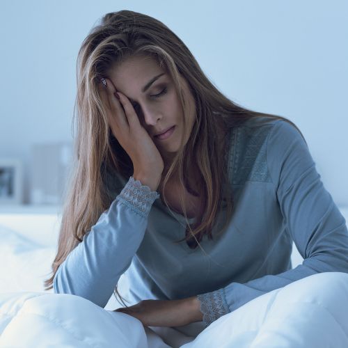 woman in bed affected by mood changes