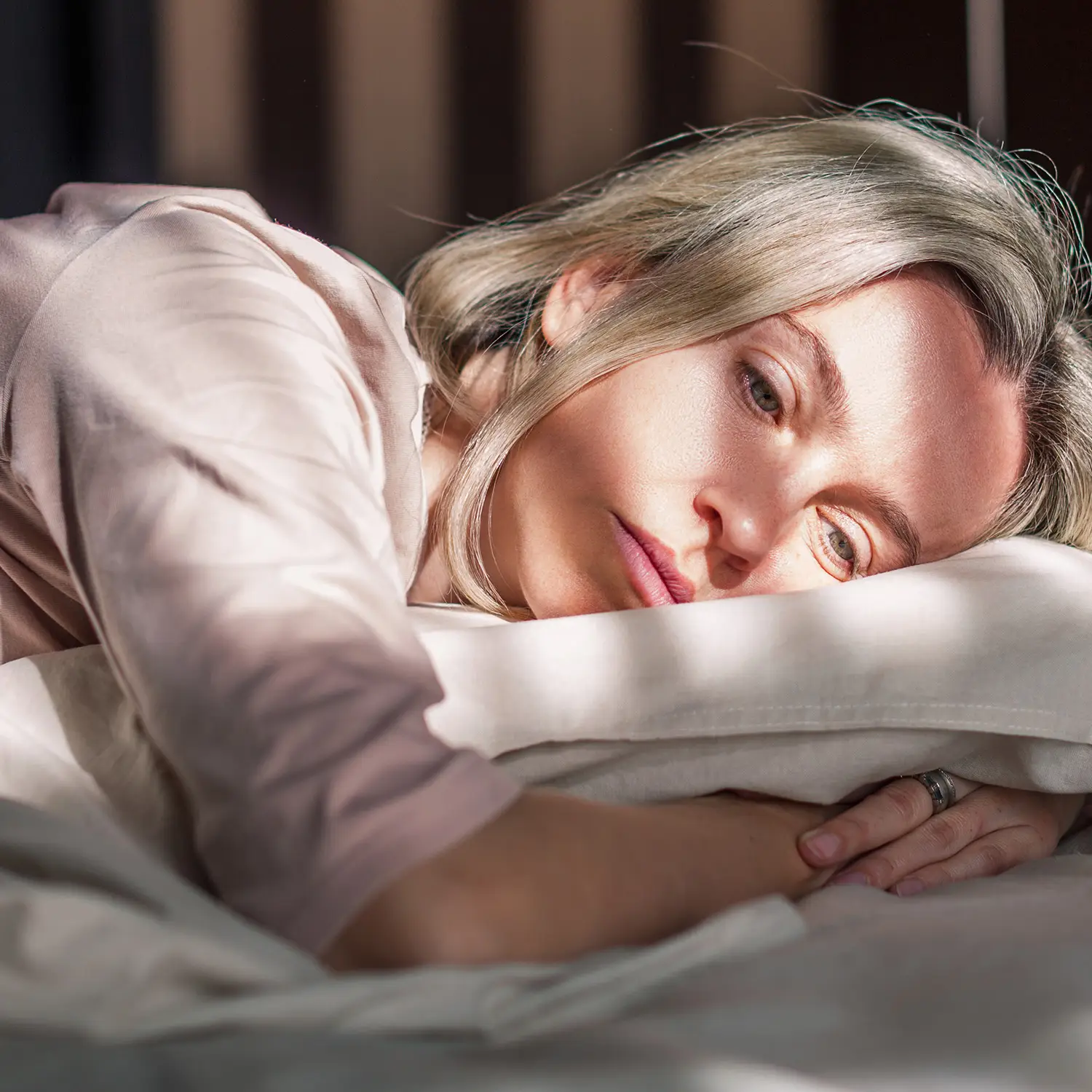 woman in bed affected by sleep disruption